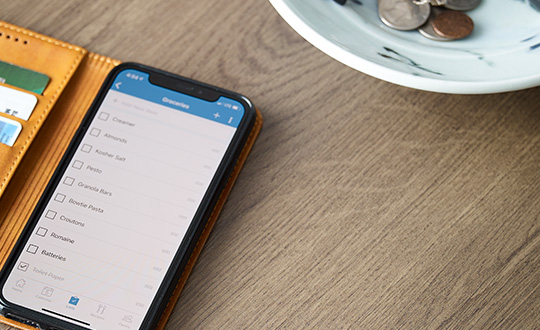 Table with Formica® Brand HPL Laminate 7413-PG Planked Coffee Oak, phone on the table